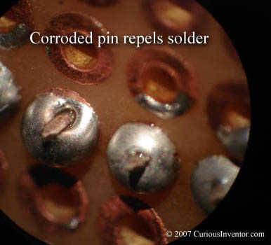Corroded pin repels solder