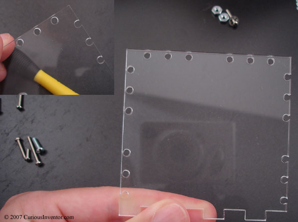 screw holes cut into acrylic varying distances from the edge
