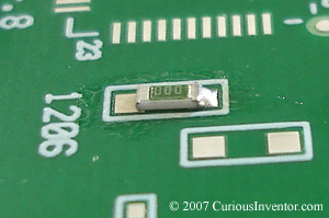 One side of a 1206 resistor tacked